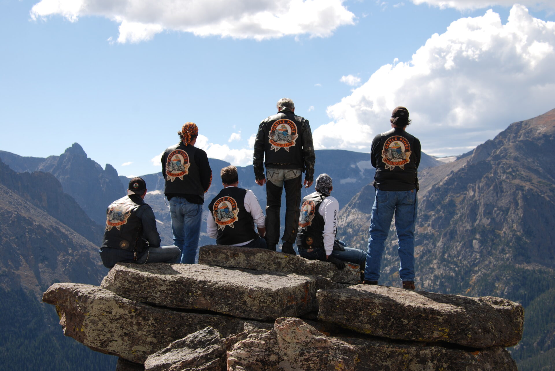 Six motorcycle club members on top of a rocky mountain